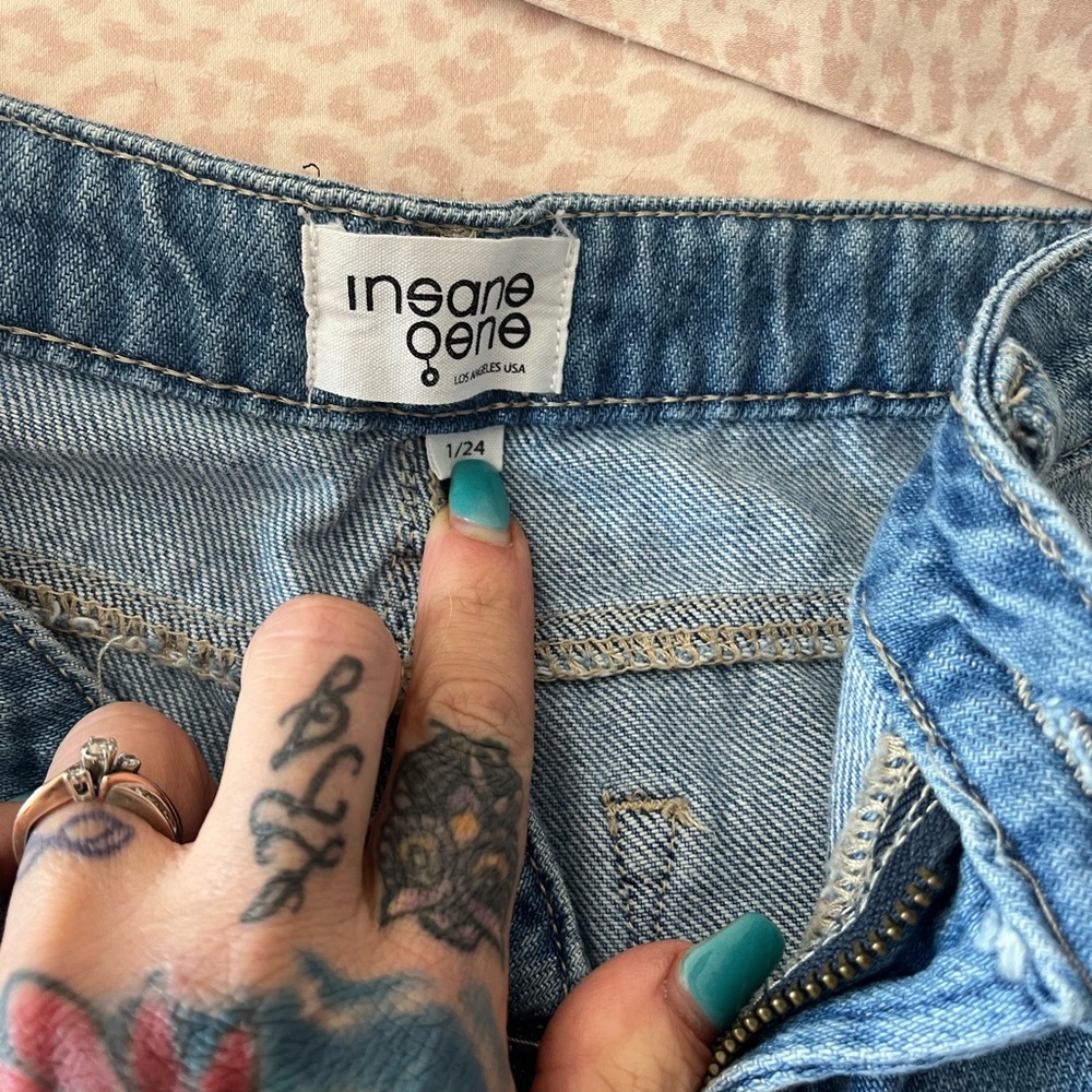 Light Blue Distressed Jeans with Golden Stitching